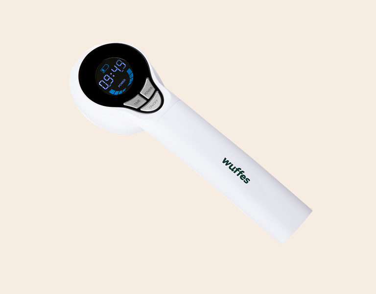 Digital handheld timer device with black circular screen and white body with buttons